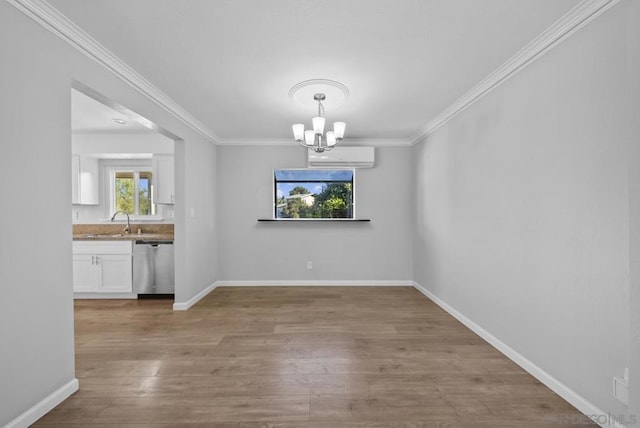 unfurnished dining area featuring a chandelier, light wood-type flooring, a wall mounted AC, and crown molding