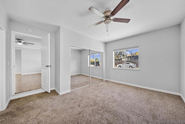 unfurnished bedroom featuring carpet flooring, a closet, and ceiling fan