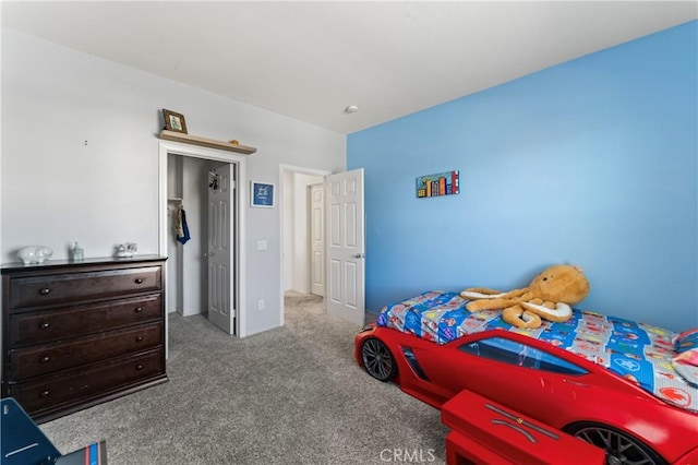 bedroom featuring light carpet