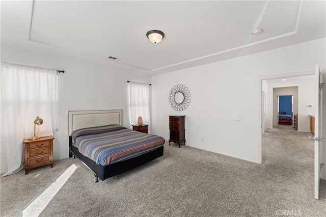 bedroom featuring light colored carpet