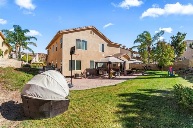 back of house featuring a patio area, a gazebo, and a lawn