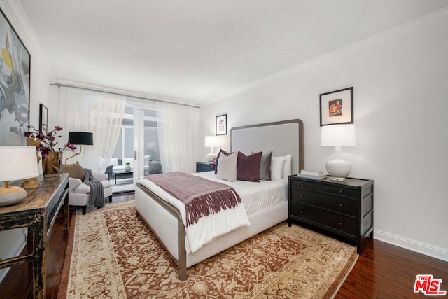 bedroom with dark hardwood / wood-style flooring and ornamental molding