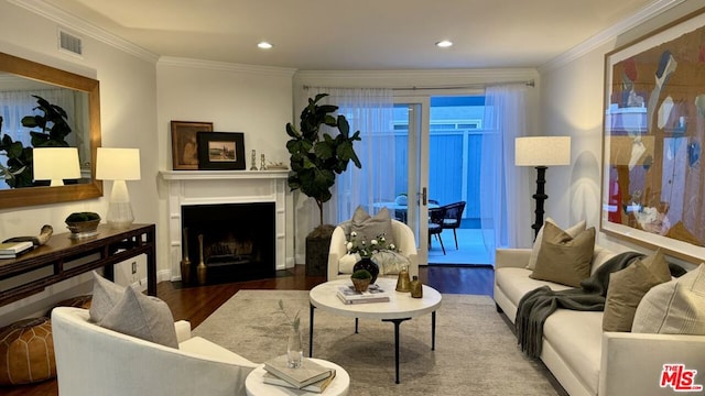 living room featuring ornamental molding and dark wood-type flooring