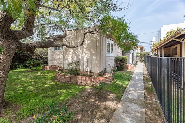 view of property exterior featuring a yard