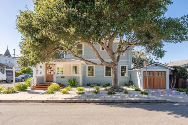 view of front of house featuring a garage and an outdoor structure