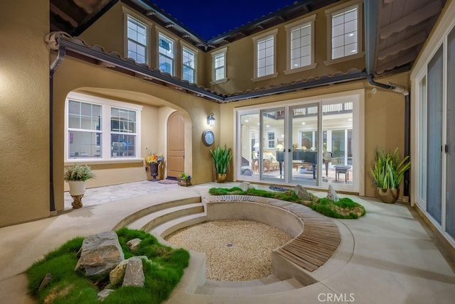 property entrance featuring french doors