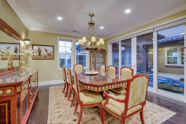 dining area with crown molding, french doors, a chandelier, and dark hardwood / wood-style floors