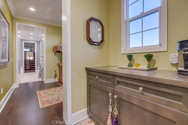 bathroom with hardwood / wood-style floors, vanity, and ornamental molding