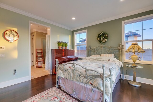 bedroom featuring hardwood / wood-style flooring and crown molding