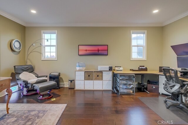 office with a healthy amount of sunlight, ornamental molding, and dark wood-type flooring