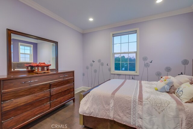 bedroom featuring crown molding and multiple windows