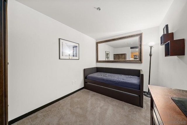 bedroom featuring light colored carpet