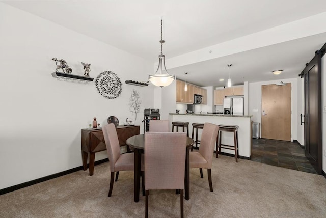 view of carpeted dining area