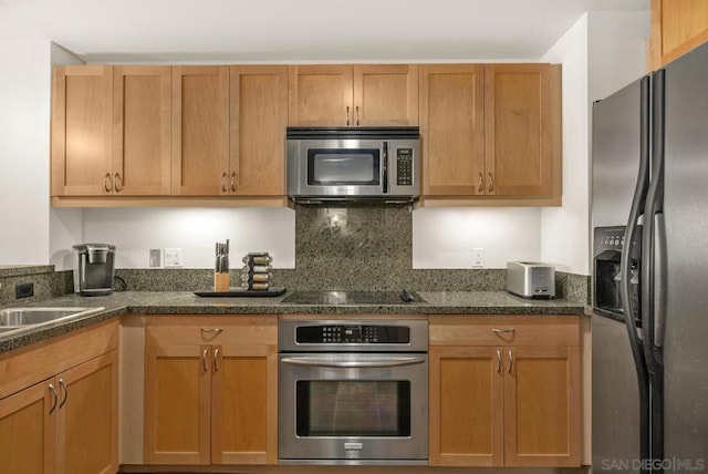 kitchen with appliances with stainless steel finishes and sink