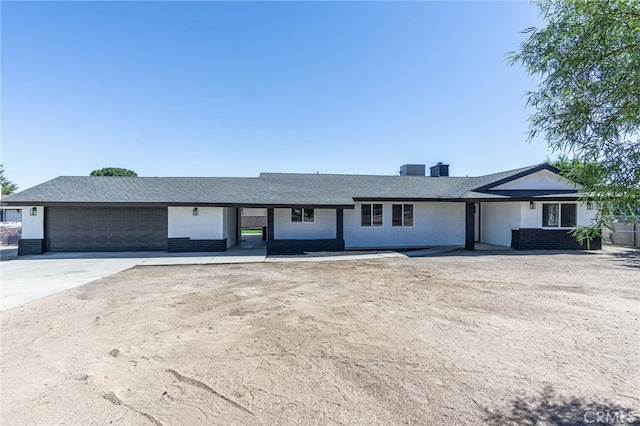 ranch-style home with a garage