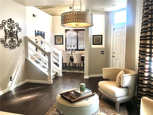 sitting room featuring wood ceiling and dark wood-type flooring