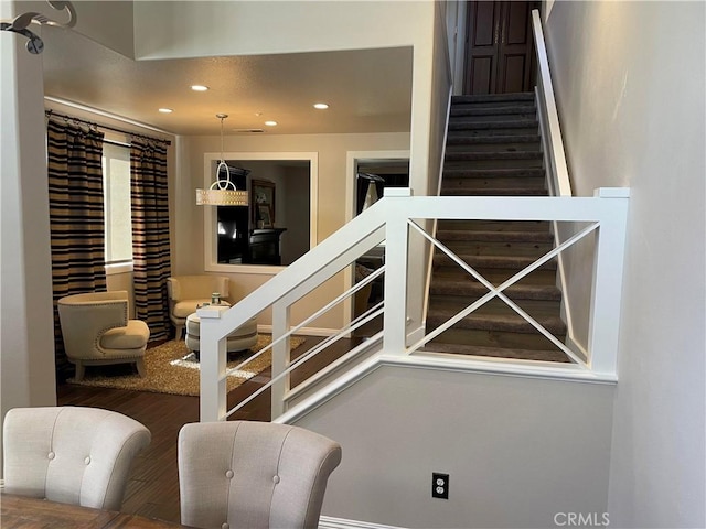 stairway featuring hardwood / wood-style floors