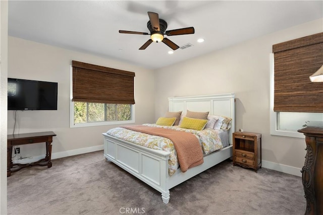 bedroom with light colored carpet and ceiling fan