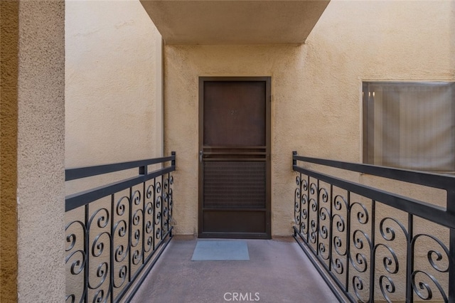 property entrance with a balcony