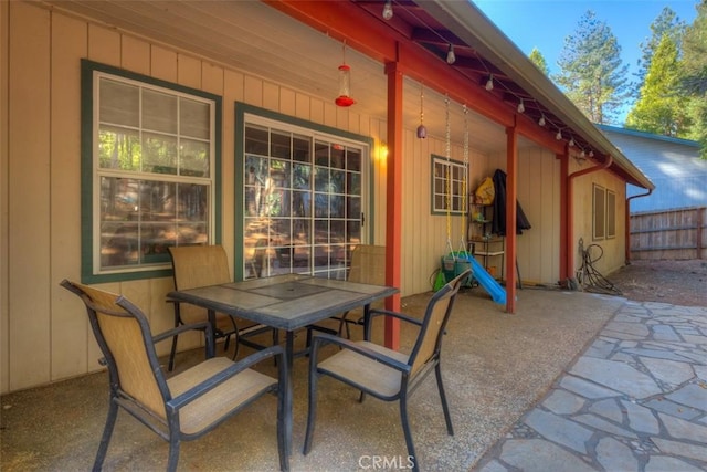view of patio / terrace with outdoor dining space and fence