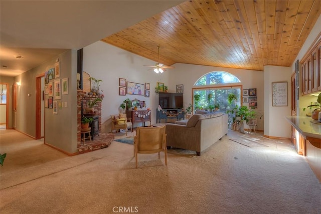 living room featuring baseboards, a ceiling fan, light carpet, and wooden ceiling
