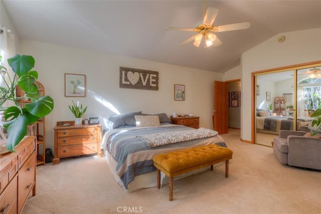 bedroom featuring light carpet, a closet, ceiling fan, and vaulted ceiling