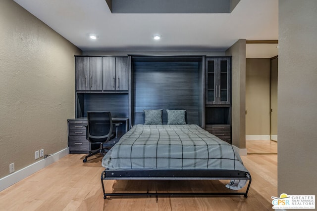 bedroom with light hardwood / wood-style flooring