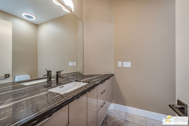 bathroom featuring vanity, toilet, and tile patterned floors