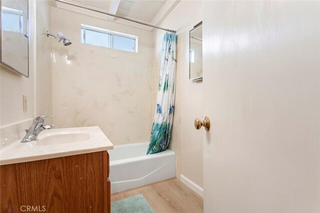 bathroom featuring vanity, shower / tub combo, and wood-type flooring