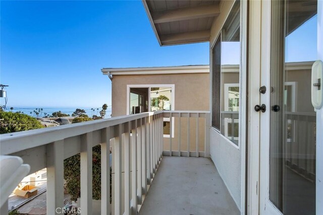 balcony featuring a water view