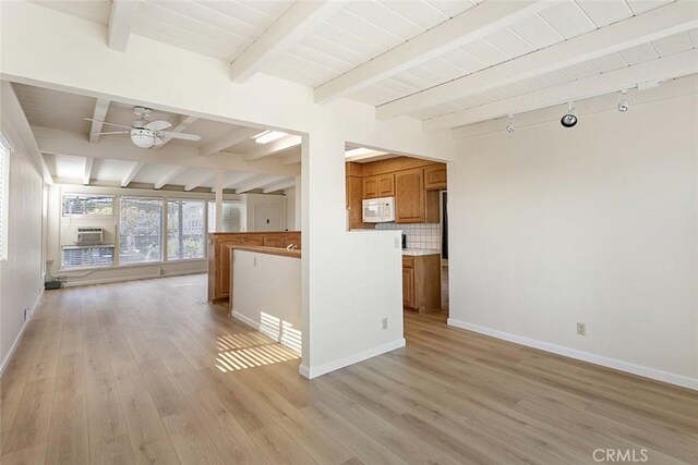 kitchen with light hardwood / wood-style flooring, decorative backsplash, beam ceiling, and ceiling fan