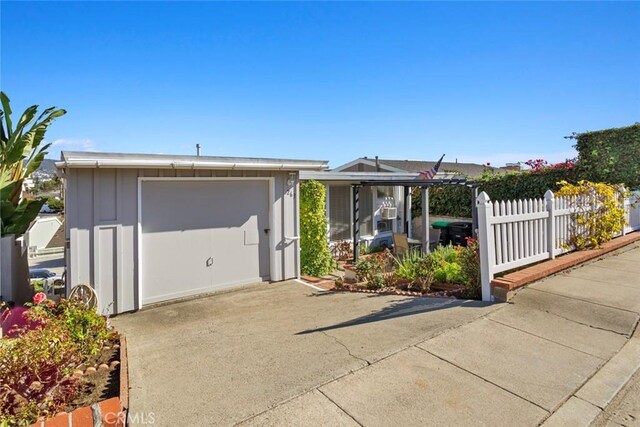 view of front of house with an outdoor structure and a garage