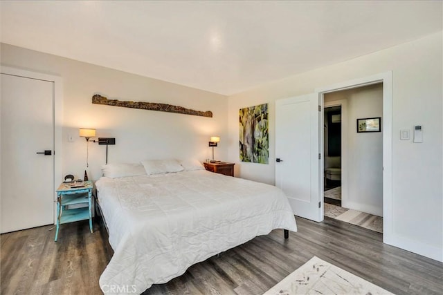 bedroom featuring dark hardwood / wood-style floors