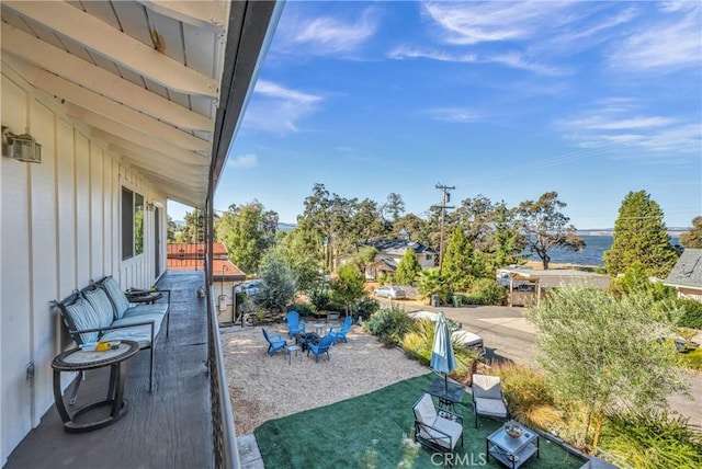 view of yard featuring a water view and a patio area