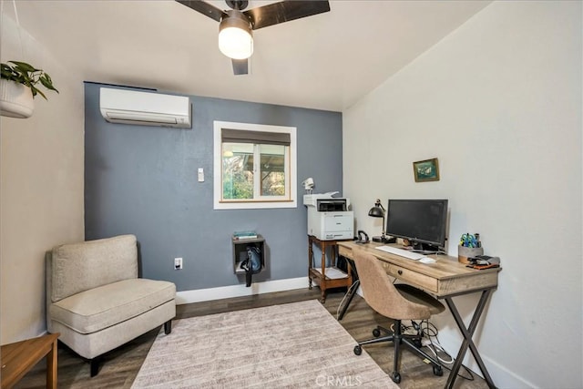 office space with a wall mounted air conditioner and hardwood / wood-style floors