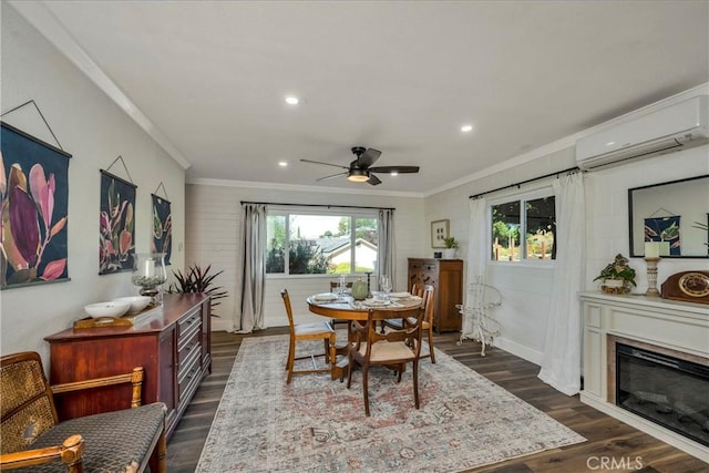 dining area with an AC wall unit, dark wood-type flooring, and crown molding