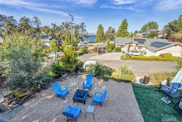 view of yard with a fire pit