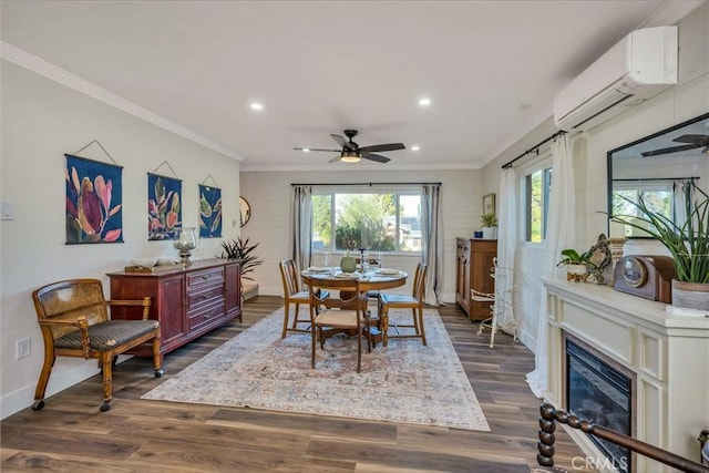 dining area featuring ceiling fan, ornamental molding, dark hardwood / wood-style floors, and a wall mounted air conditioner