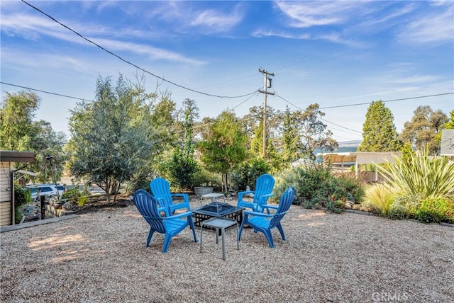 view of yard with a fire pit