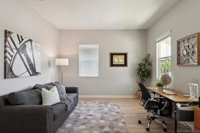 office with light wood-type flooring