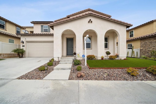 mediterranean / spanish-style house with a front lawn and a garage