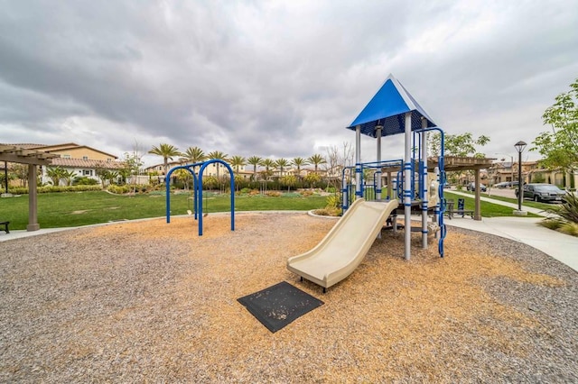 view of playground with a lawn