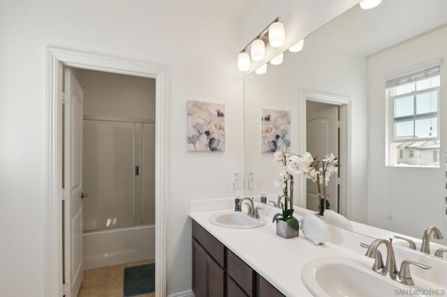 bathroom with vanity, combined bath / shower with glass door, and tile patterned floors