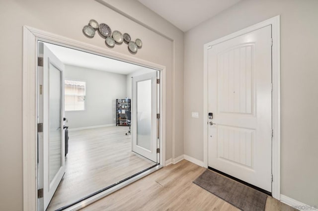 entryway with light hardwood / wood-style flooring