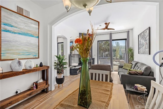 sitting room featuring light hardwood / wood-style floors and ceiling fan