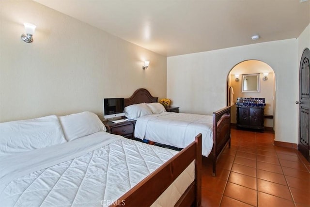 bedroom featuring dark tile patterned floors