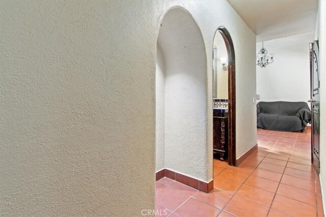 hallway with light tile patterned floors