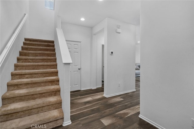 stairway featuring hardwood / wood-style floors