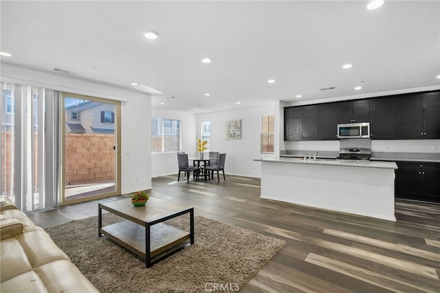 living room featuring dark wood-type flooring