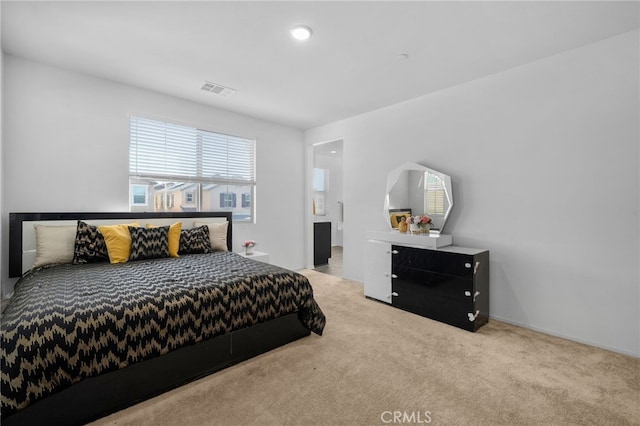 bedroom featuring light carpet